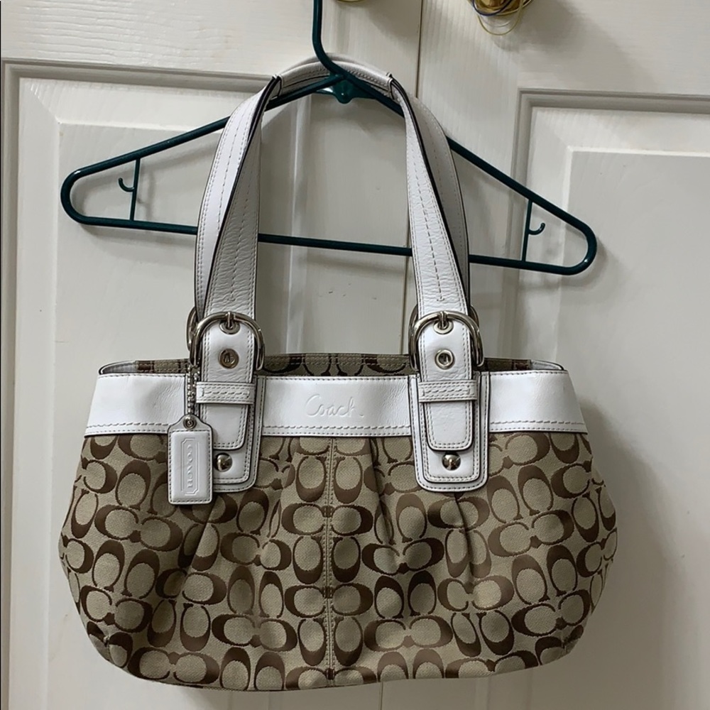 Tan Coach purse with white leather straps and trim